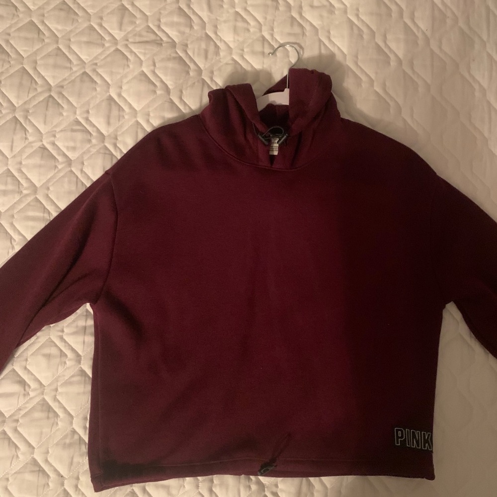Pink cropped hoodie.